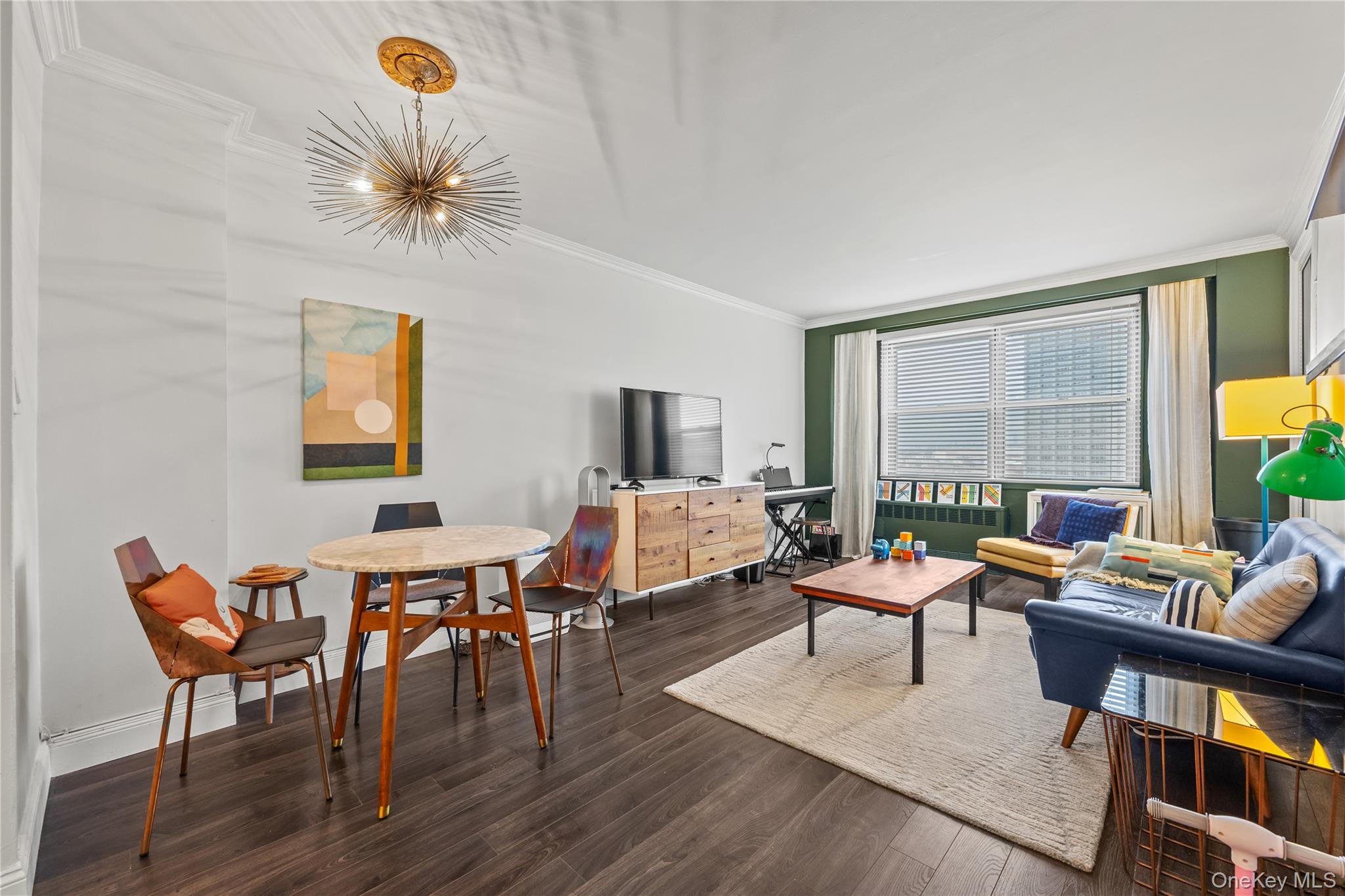 61-15 97th Street, Unit 10A Queens, NY 11374 - Photo 7 of 21 Living area featuring dark wood-type flooring and ornamental molding