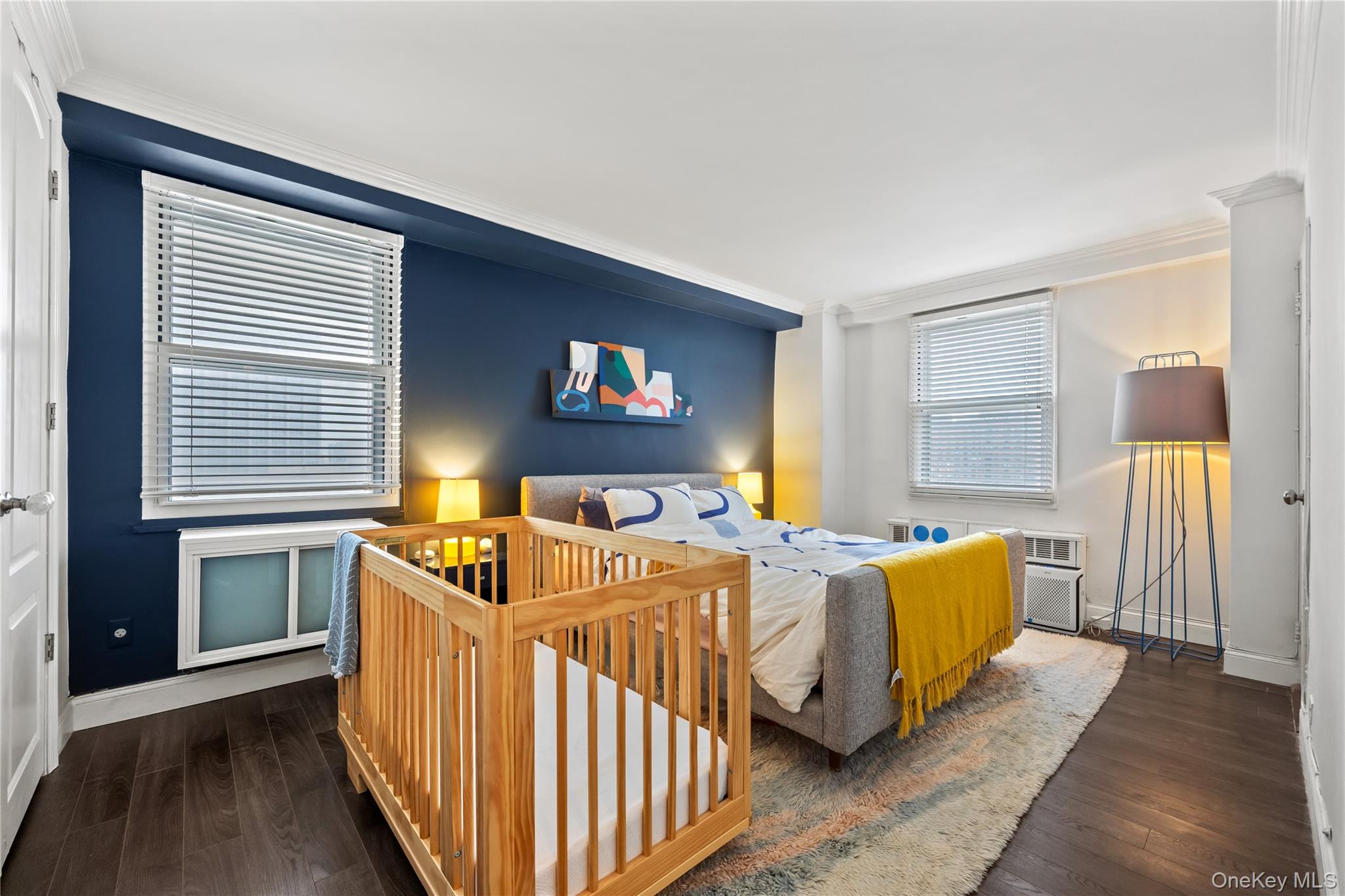 61-15 97th Street, Unit 10A Queens, NY 11374 - Photo 9 of 21 Bedroom featuring crown molding and dark wood finished floors