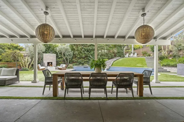 a view of a dining table and chairs in a room