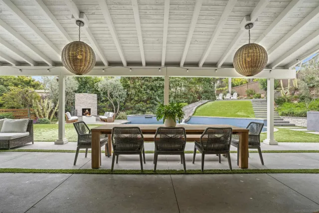 a view of a dining table and chairs in a room