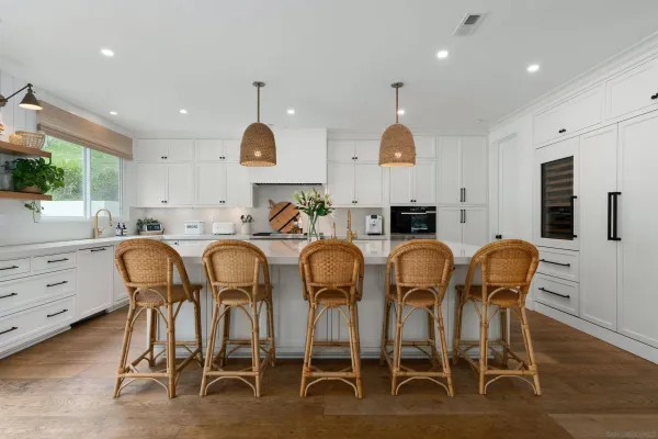 a dining room with furniture a window and kitchen view