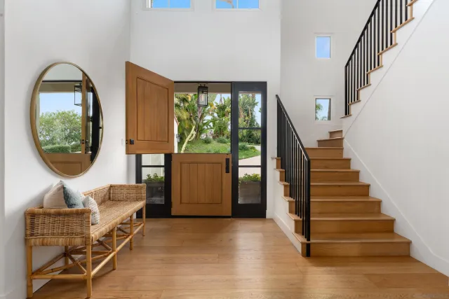 a view of entryway with wooden floor and door