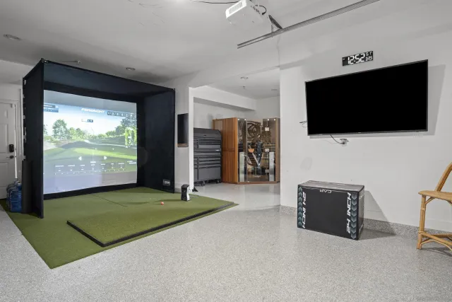 a living room with a flat screen tv and a fireplace