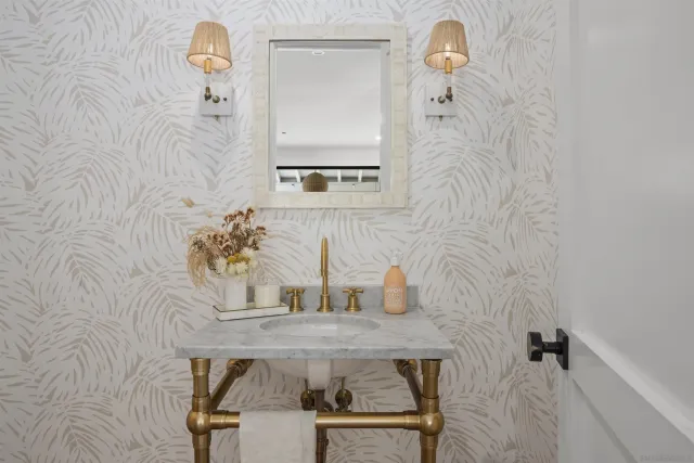 a kitchen with stainless steel appliances a sink and a refrigerator