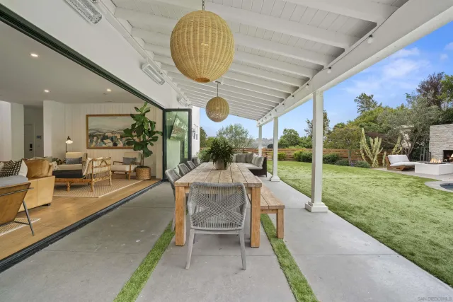 a view of swimming pool with outdoor seating and yard