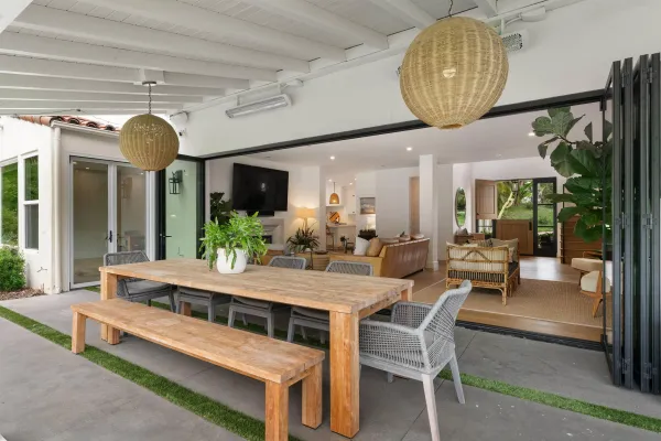 a view of a dining room with furniture wooden floor and chandelier