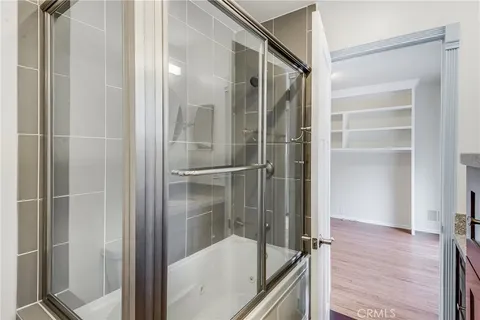 a bathroom with a glass shower door