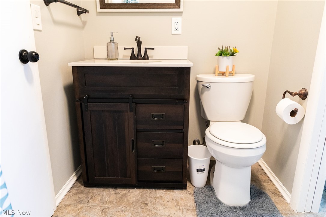 802 Dutch Ridge Road Parkersburg, WV 26104 - Photo 19 of 25 Bathroom featuring vanity, toilet, and tile flooring