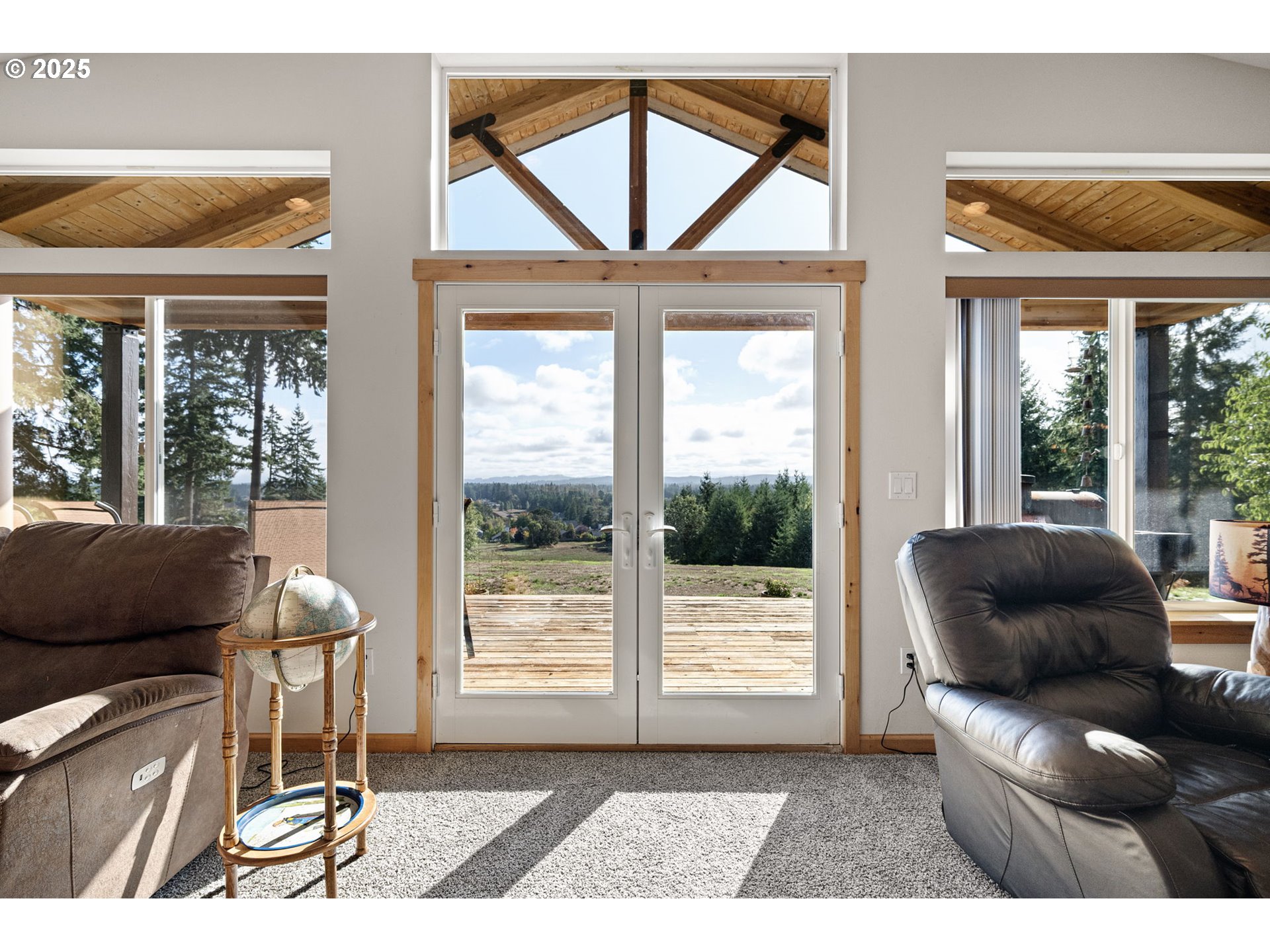 24674 Bolton Hill Road Veneta, OR 97487 - Photo 12 of 48 a living room with furniture and a floor to ceiling window
