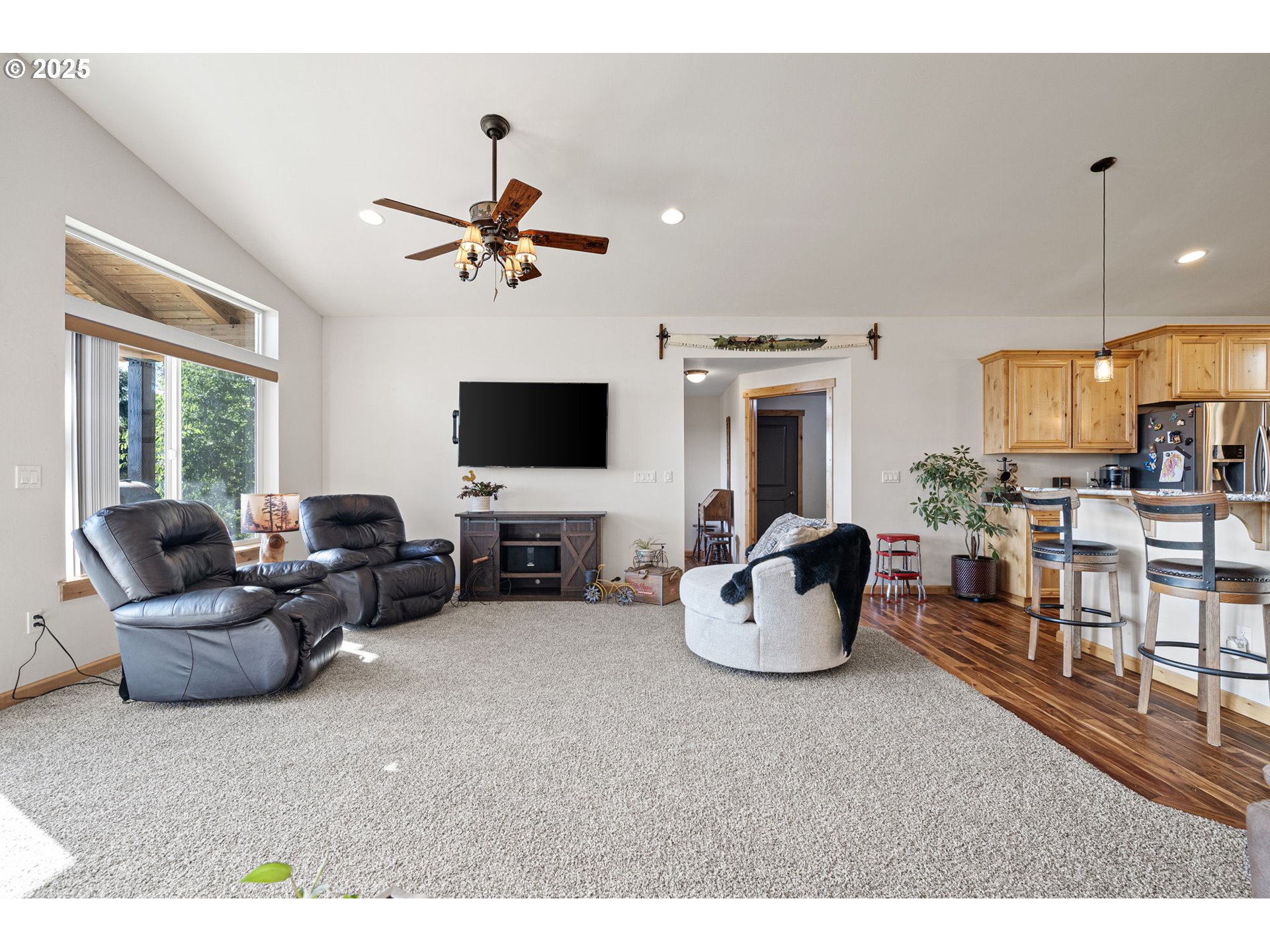 24674 Bolton Hill Road Veneta, OR 97487 - Photo 23 of 48 a living room with furniture and a flat screen tv