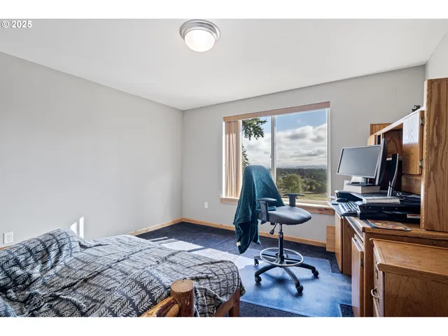 a workspace with furniture and a window