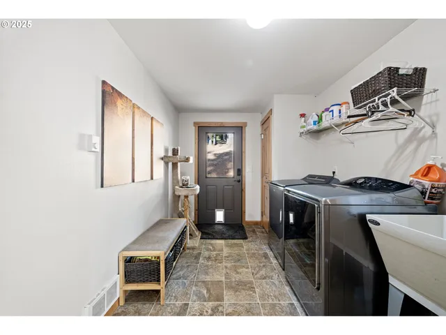 a living room with furniture a dining table and wooden floor