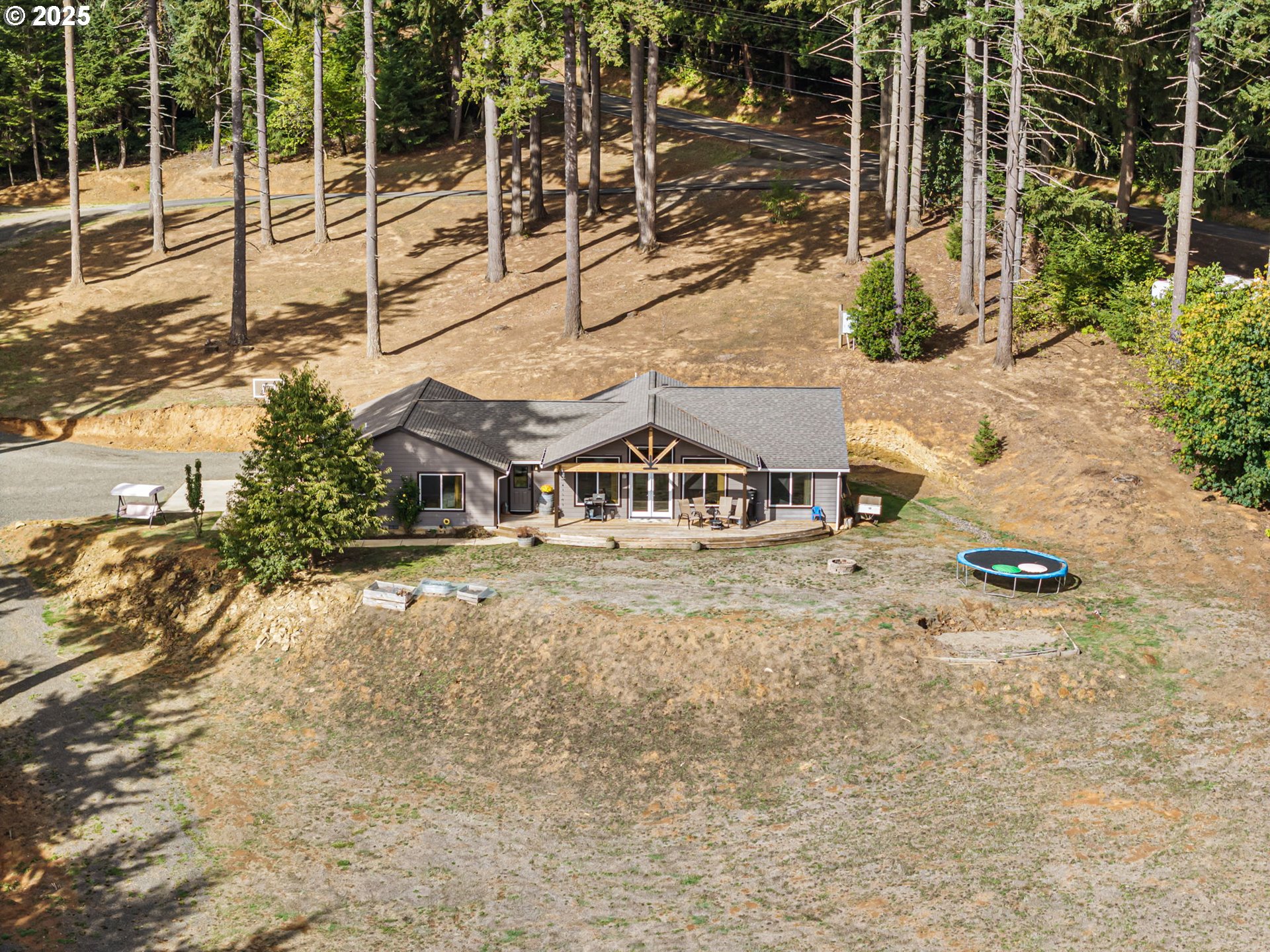 24674 Bolton Hill Road Veneta, OR 97487 - Photo 41 of 48 a view of a house with a yard