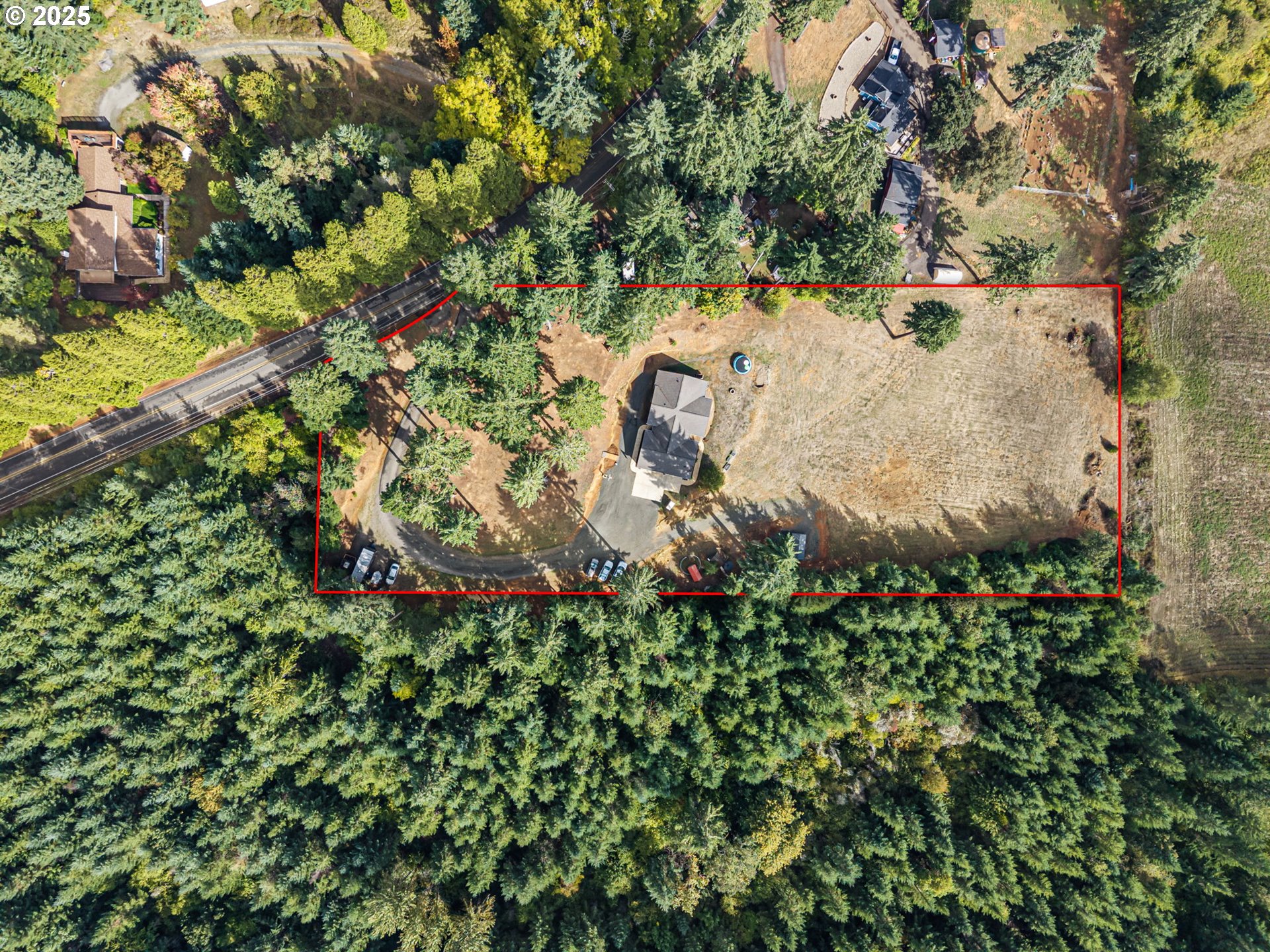 24674 Bolton Hill Road Veneta, OR 97487 - Photo 47 of 48 an aerial view of a house with a yard and covered with trees
