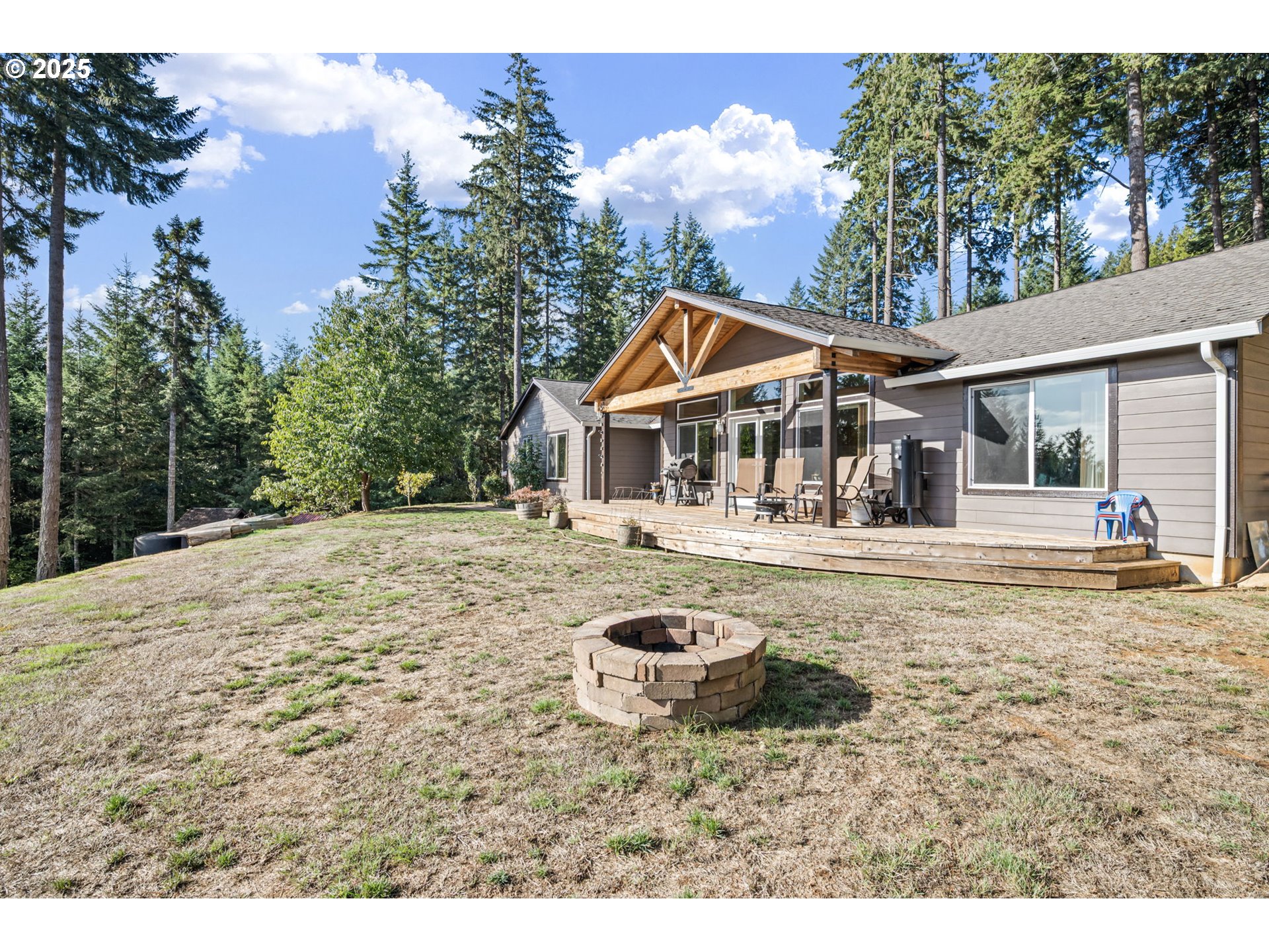 24674 Bolton Hill Road Veneta, OR 97487 - Photo 5 of 48 a house with swimming pool in front of it