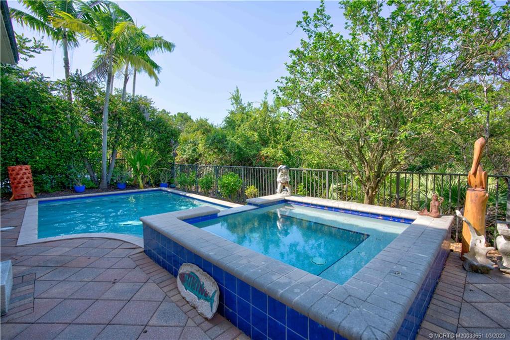 112 Tulip Tree Court Jupiter, FL 33458 - Photo 25 of 76 a view of a swimming pool with a patio