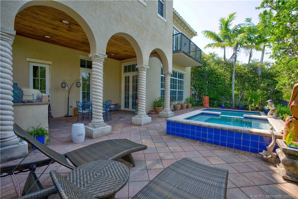112 Tulip Tree Court Jupiter, FL 33458 - Photo 27 of 76 a front view of house with yard outdoor seating and barbeque oven