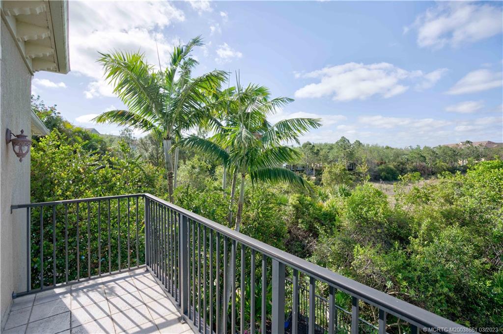 112 Tulip Tree Court Jupiter, FL 33458 - Photo 3 of 76 a balcony with trees in front of it