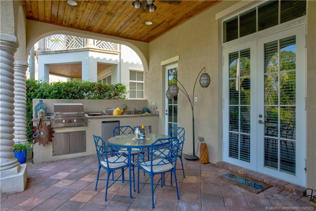 112 Tulip Tree Court Jupiter, FL 33458 - Photo 31 of 76 a view of a dining room with furniture and a potted plant