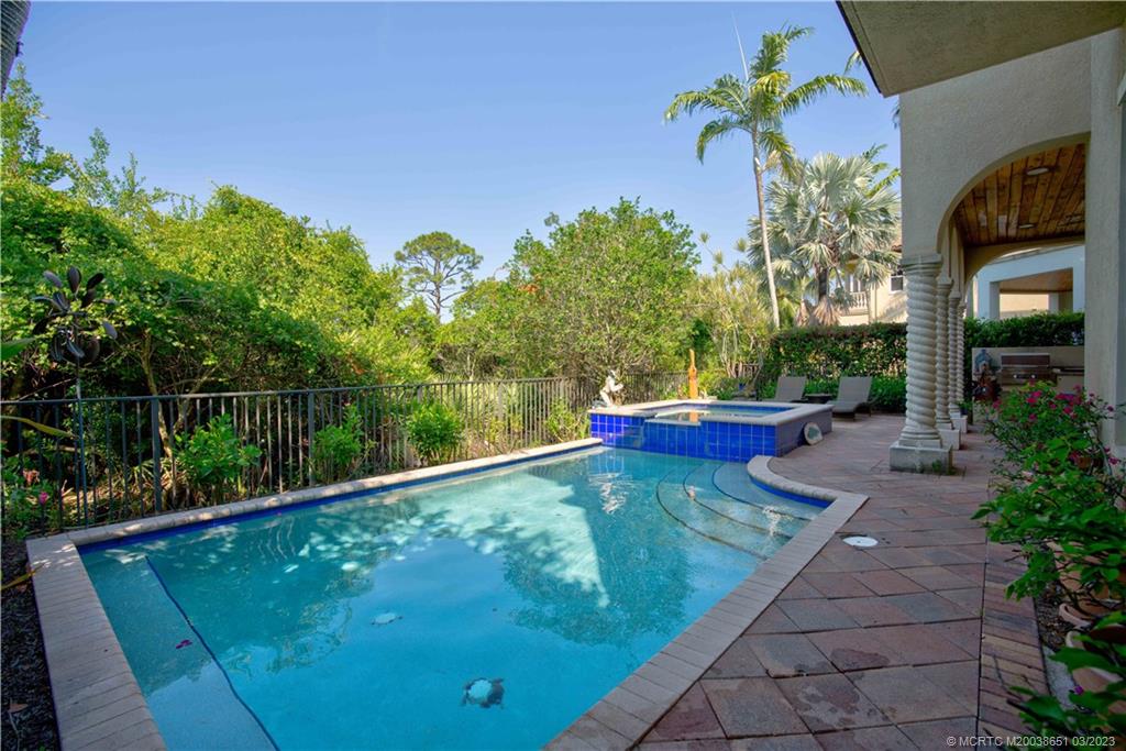 112 Tulip Tree Court Jupiter, FL 33458 - Photo 32 of 76 a view of a back yard of the house