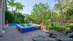 112 Tulip Tree Court Jupiter, FL 33458 - Photo 35 of 76 a view of backyard with outdoor seating and green space