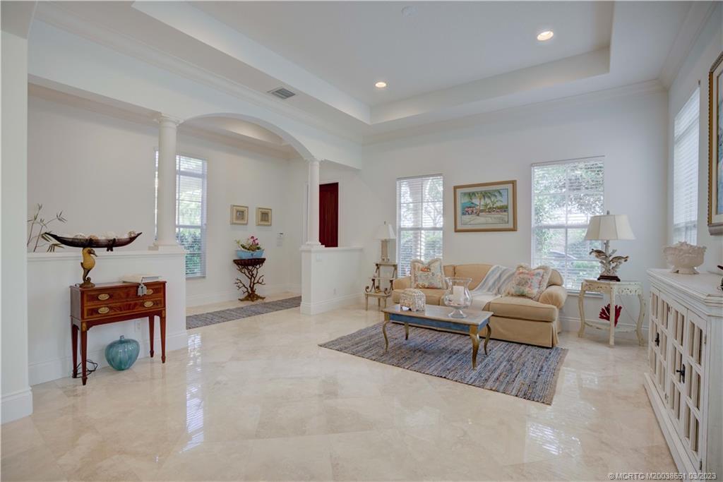 112 Tulip Tree Court Jupiter, FL 33458 - Photo 44 of 76 a living room with furniture and a flat screen tv