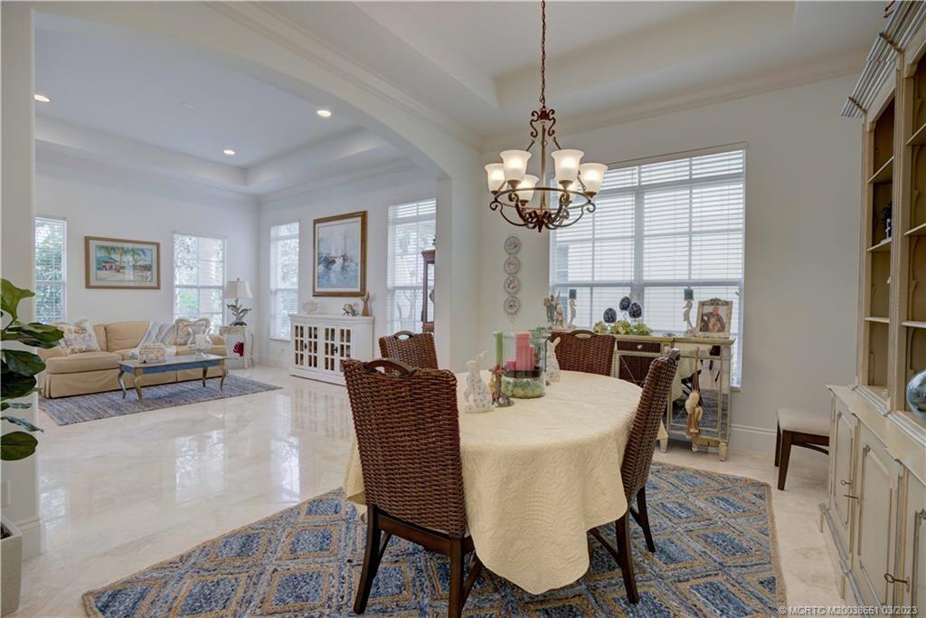 112 Tulip Tree Court Jupiter, FL 33458 - Photo 46 of 76 a view of a dining room with furniture window and wooden floor
