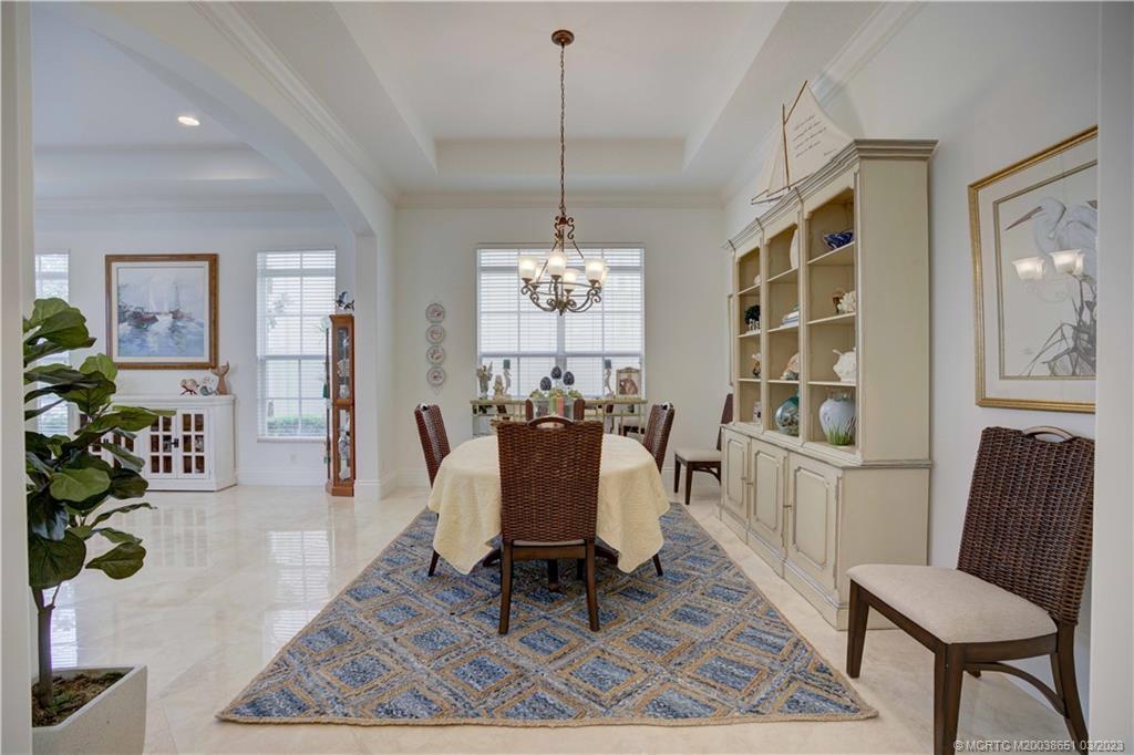112 Tulip Tree Court Jupiter, FL 33458 - Photo 47 of 76 a view of a dining room with furniture window and wooden floor