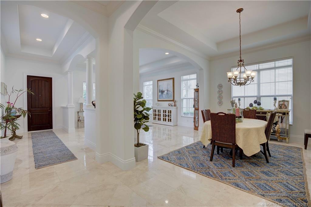 112 Tulip Tree Court Jupiter, FL 33458 - Photo 48 of 76 a view of a dining room with furniture window and wooden floor