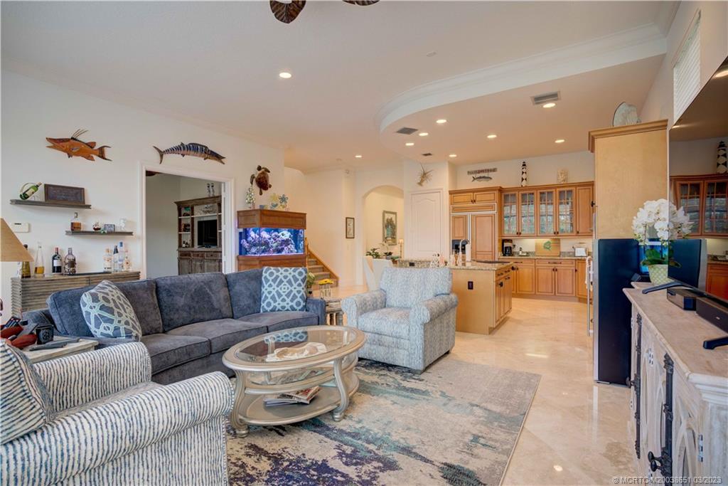112 Tulip Tree Court Jupiter, FL 33458 - Photo 49 of 76 a living room with furniture and a chandelier