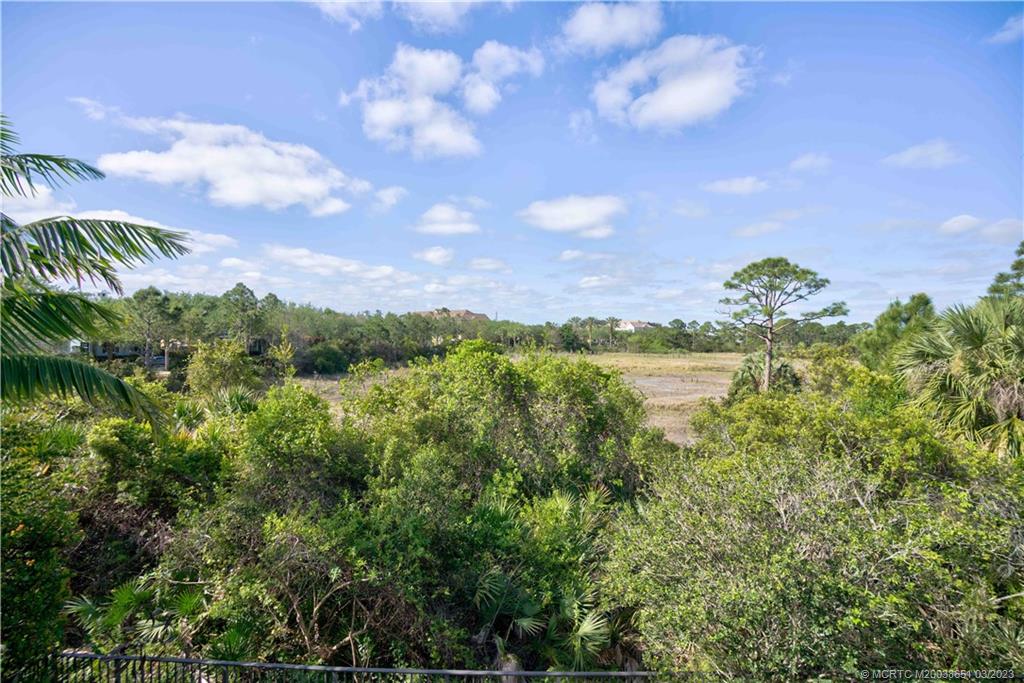 112 Tulip Tree Court Jupiter, FL 33458 - Photo 5 of 76 a view of a lake in between the bunch of trees