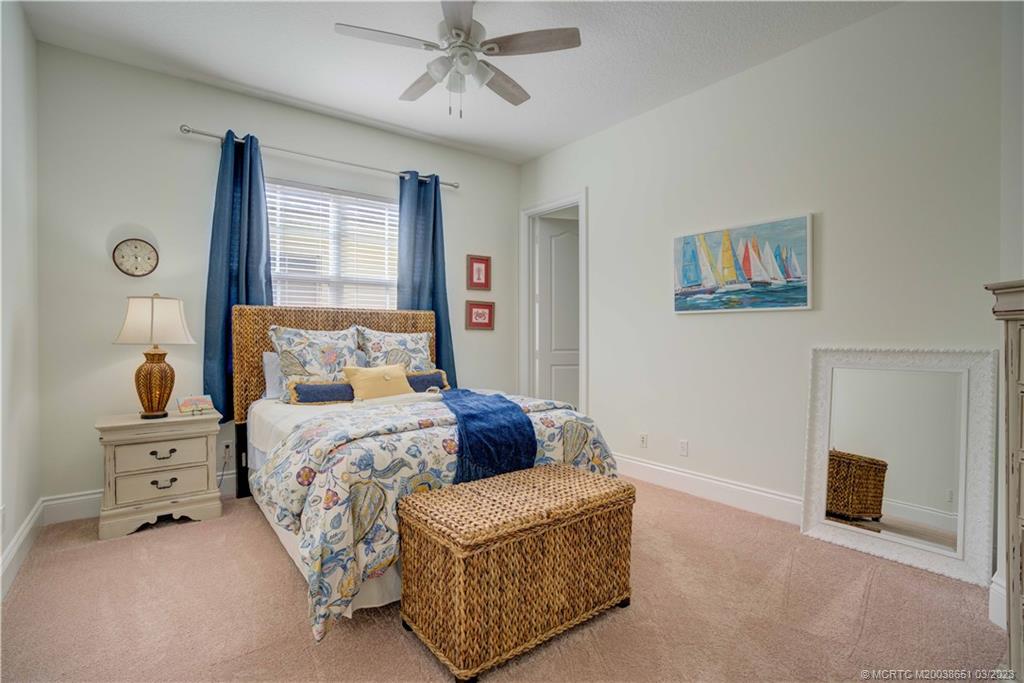 112 Tulip Tree Court Jupiter, FL 33458 - Photo 68 of 76 a bedroom with a bed and window