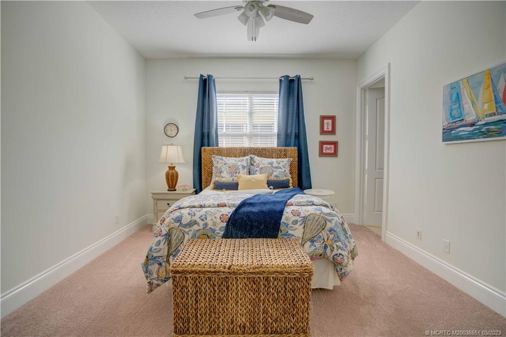 112 Tulip Tree Court Jupiter, FL 33458 - Photo 69 of 76 a bedroom with a bed and window