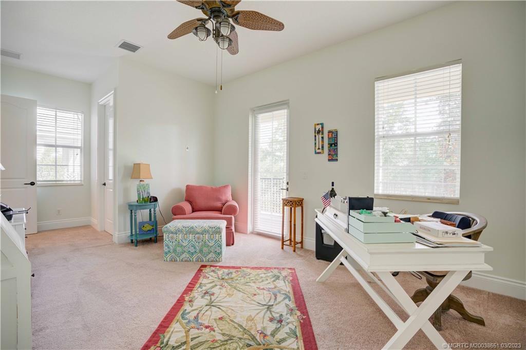 112 Tulip Tree Court Jupiter, FL 33458 - Photo 70 of 76 a bedroom with a bed and furniture