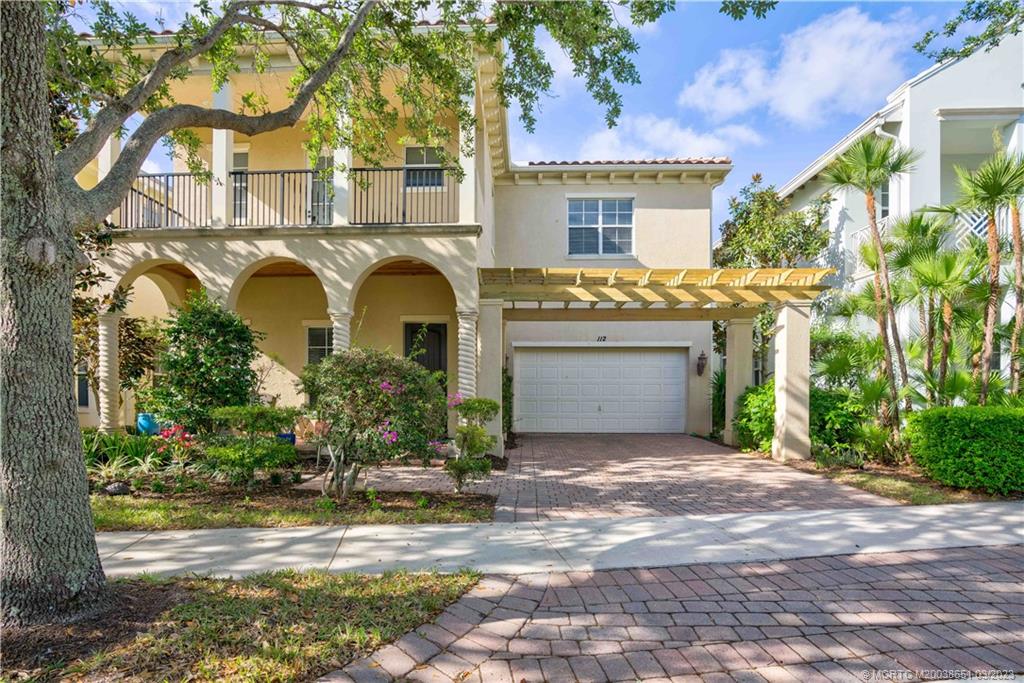 112 Tulip Tree Court Jupiter, FL 33458 - Photo 7 of 76 a front view of a house with a garden