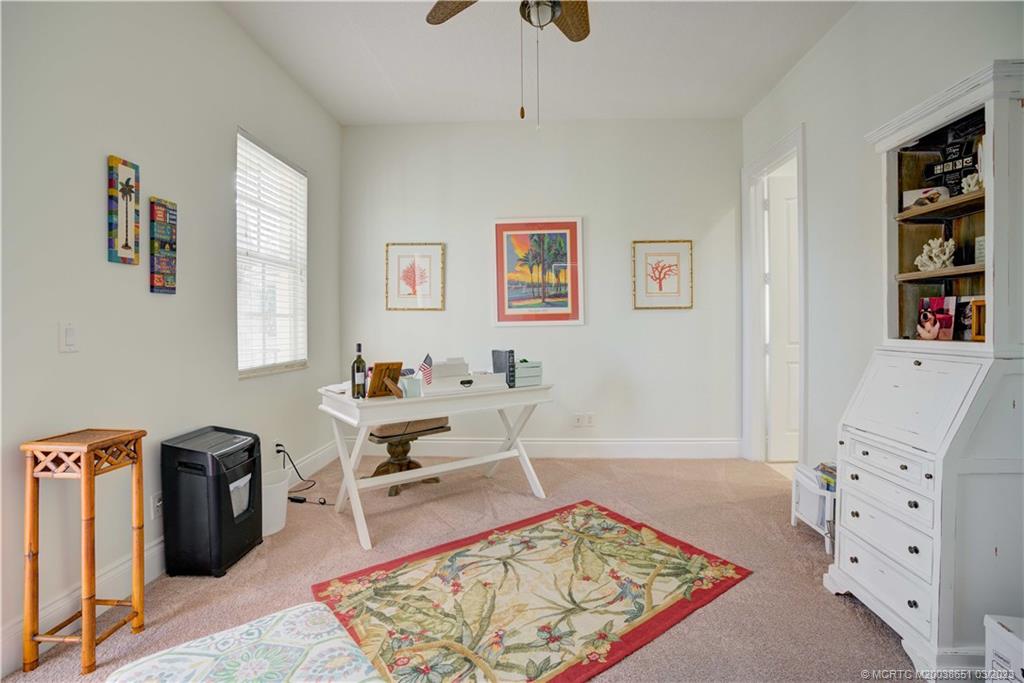 112 Tulip Tree Court Jupiter, FL 33458 - Photo 71 of 76 a living room with furniture and a rug