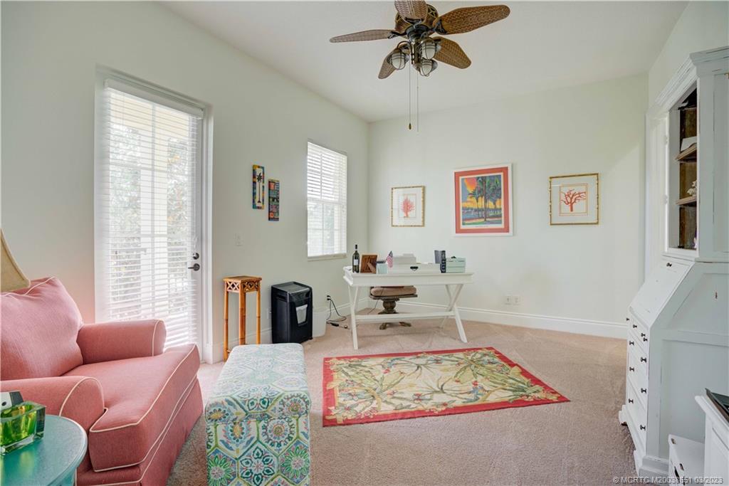 112 Tulip Tree Court Jupiter, FL 33458 - Photo 72 of 76 a living room with furniture and a rug