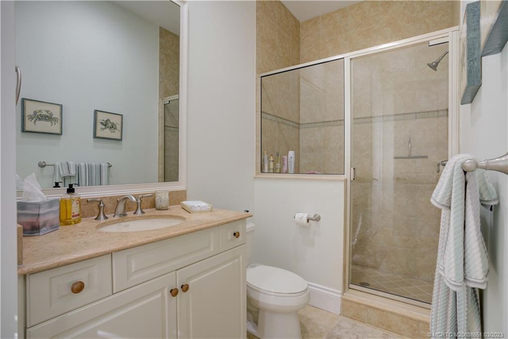112 Tulip Tree Court Jupiter, FL 33458 - Photo 74 of 76 a bathroom with a sink toilet and shower