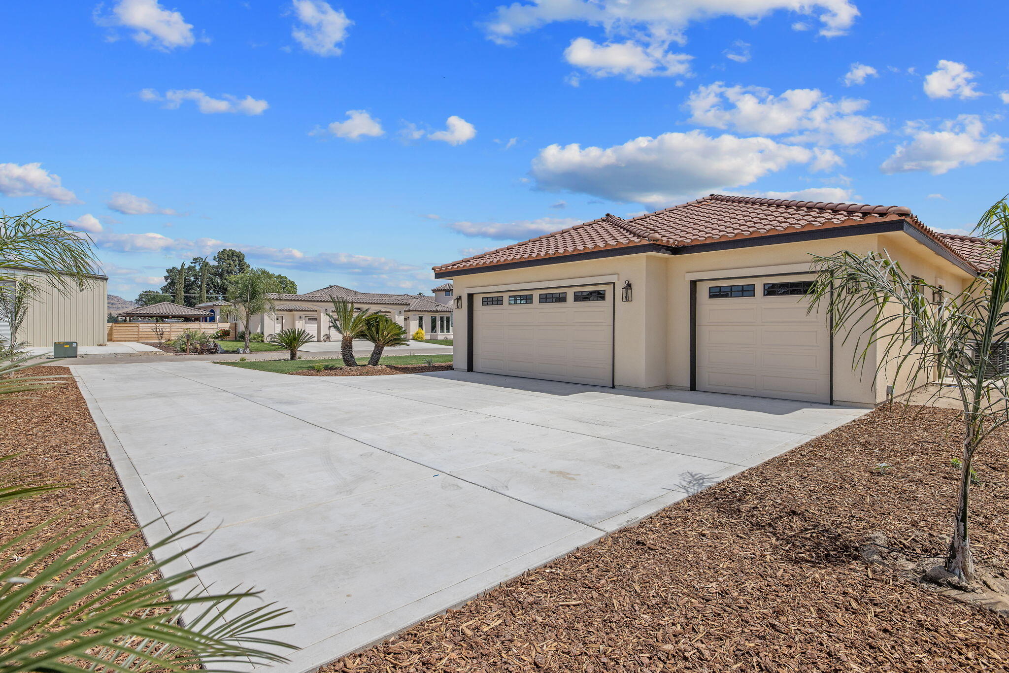 503 East Palm Street Exeter, CA 93221 - Photo 6 of 92 a front view of a house with a yard and garage
