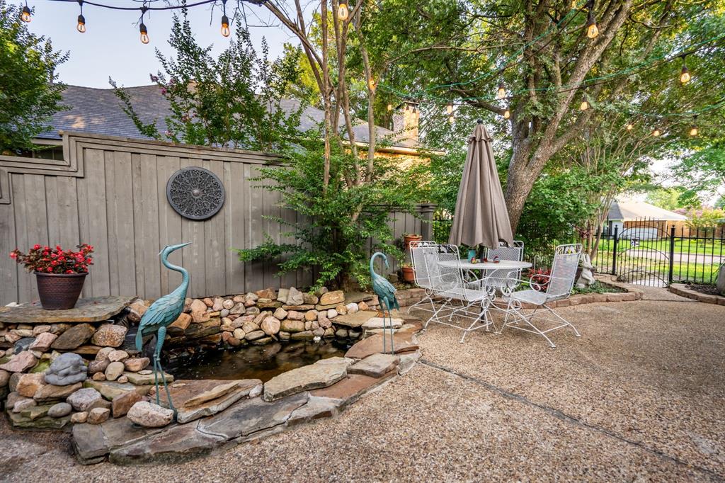 1450 Meandering Way Rockwall, TX 75087 - Photo 6 of 32 a view of a chairs and tables in the patio