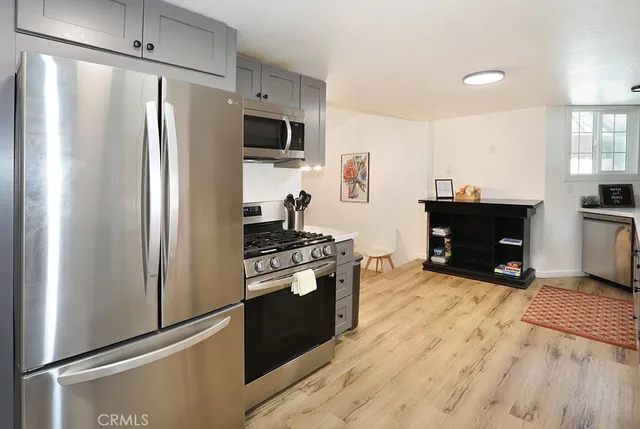 a kitchen with cabinets and white appliances