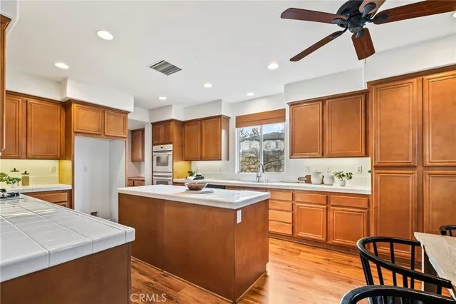 a kitchen with sink cabinets and window