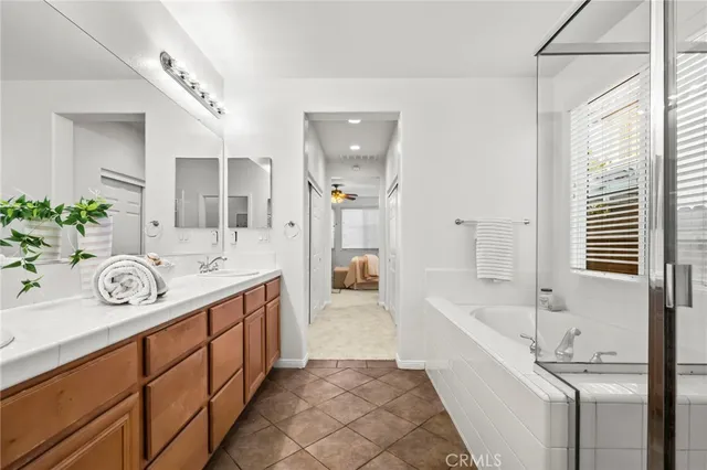 a spacious bathroom with a sink and a bathtub