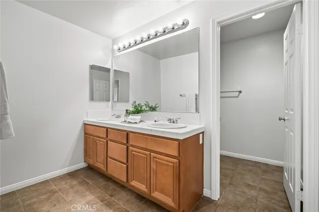 a room with a sink and a mirror