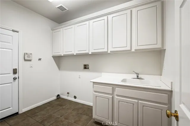 a bathroom with a sink and cabinets