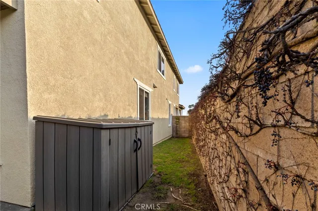 a balcony with wooden floor and fence