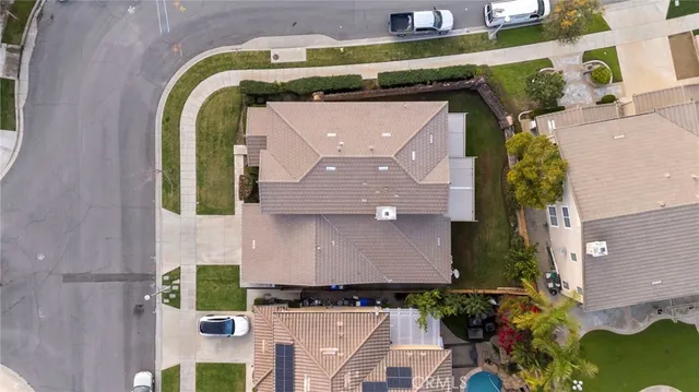 an aerial view of a house with a swimming pool