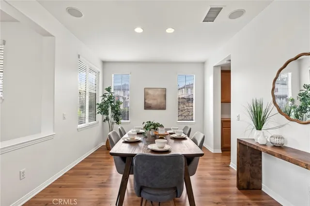 a view of a dining room with furniture and window