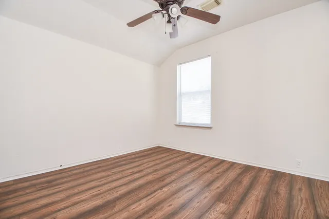 a bathroom with a double vanity sink toilet mirror and bathtub