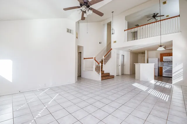 a view of a livingroom with furniture and an entryway
